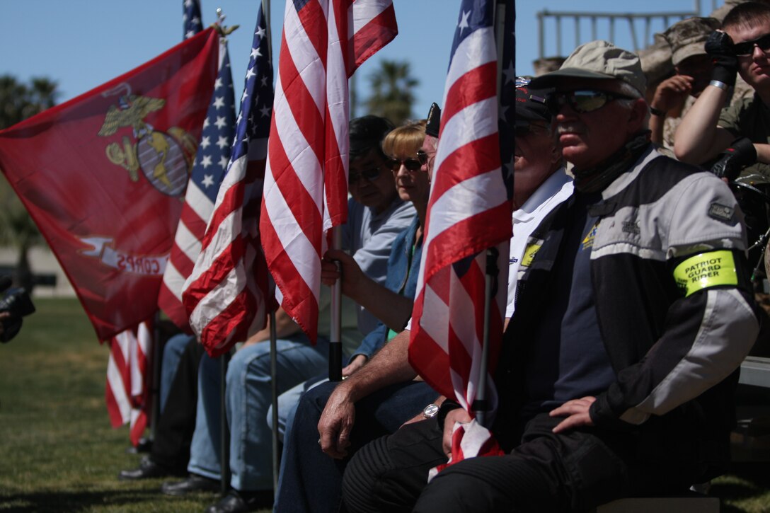 Members of the patriot guard riders, a group of motorcyclists with a shared respect for those who risk their lives in protection of America, show their support during the Navy Cross ceremony honoring Lance Cpl. Brady Gustafson at Lance Cpl. Torrey Grey Field March 27.