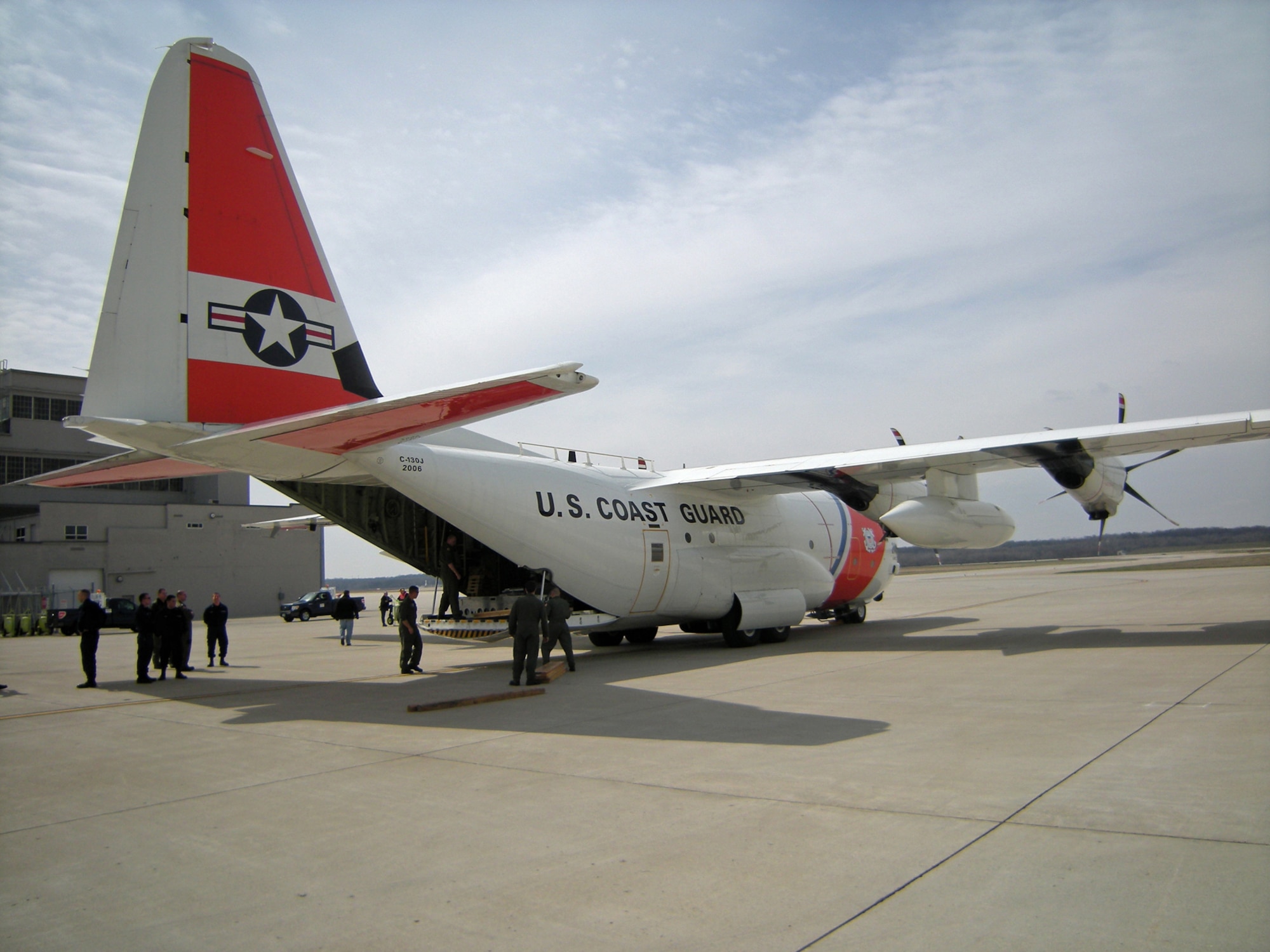 A C-130J Hercules aircraft from Coast Guard Station Elizabeth City, N.C. arrived at Wright-Patterson Air Force Base, Ohio Friday, March 27, where it met a Cincinnati-based Disaster Assistance Response Team to be flown to flood ravaged Fargo, N.D.  The eight-member team is specially trained to conduct marine rescue and evacuations. (U.S. Air Force photo/Cason Soat)