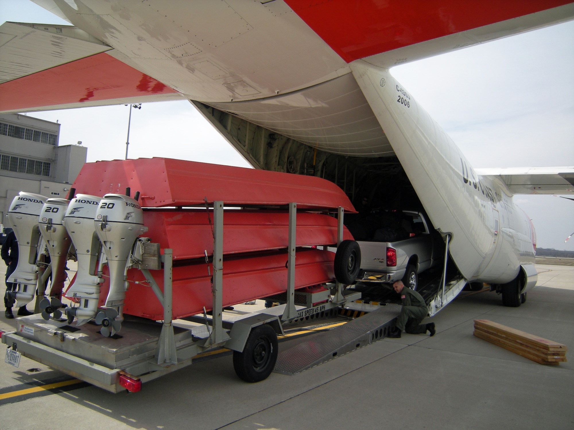 A  U.S. Coast Guard Disaster Assistance Response Team’s equipment is loaded aboard a C-130J Hercules aircraft at Wright-Patterson Air Force Base, Ohio Friday, March 27.  The eight-member team, based in Cincinnati will fly to Fargo, N.D. to join others supporting rescue and evacuation efforts in response to flooding on the Red River.  Coast Guard aircrews flew in from Elizabeth City, N.C. for the relief mission. (U.S. Air Force photo/Cason Soat)
