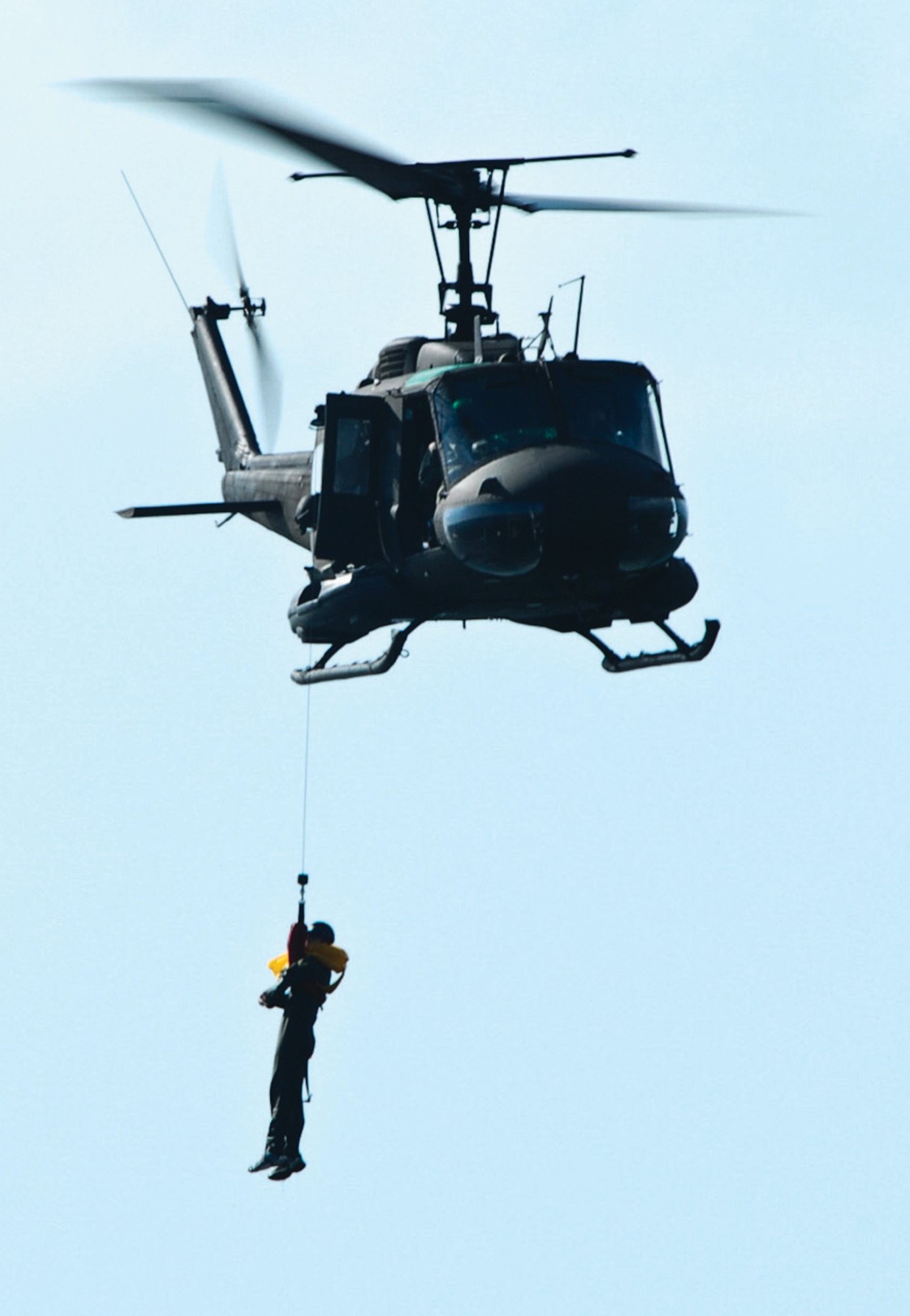 A member of the 201 AS is hoisted into a D.C. Army National Guard 
UH-1 helicopter during water survival training March 14. (U.S. Air Force photo/ Tech. Sgt. Adrianne Wilson)