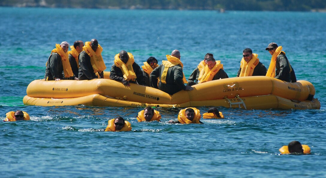 During water survival training, members of the 201 AS and National Guard Bureau swim 150 yards to a raft March 14. (U.S. Air Force photo/ Tech. Sgt. Adrianne Wilson)