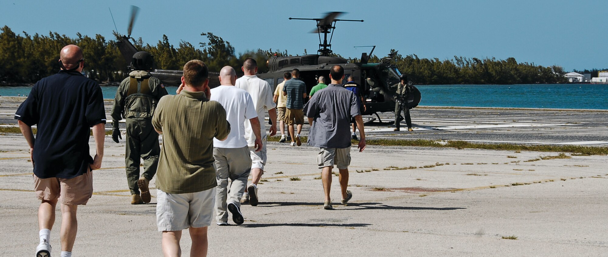 At the end of the urban navigation, members of the 201st Airlift Squadron are flown to a simulated safe location by a D.C. Army National Guard UH-1 helicopter March 13. The evacuation is part of their two-day annual survival training at Naval Air Station Key West, Fla. (U.S. Air Force photo/ Tech. Sgt. Adrianne Wilson)