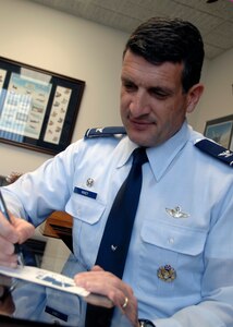 Col. Joseph Mancy fills out his Air Force Assistance Fund form at Charleston AFB, March 27. The AFAF is an annual campaign, which benefits active-duty Airmen, reservists, National Guard members, retirees and family members. The AFAF began March 23 and runs until May 3. Colonel Mancy is the acting 437th Airlift Wing vice commander. (U.S. Air Force photo/Senior Airman Katie Gieratz.) 
