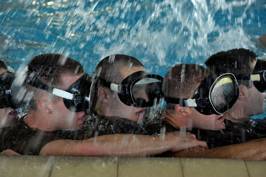 MOODY AIR FORCE BASE, Ga. -- Combat rescue officer selection course candidates from class 09A cling to one another for support after completing several physically and mentally demanding under water tasks here March 25. The candidates who survive the training here will attend the eight week CRO course at Lackland Air Force Base, Texas. (U.S. Air Force photo by Senior Airman Javier Cruz Jr.) 
