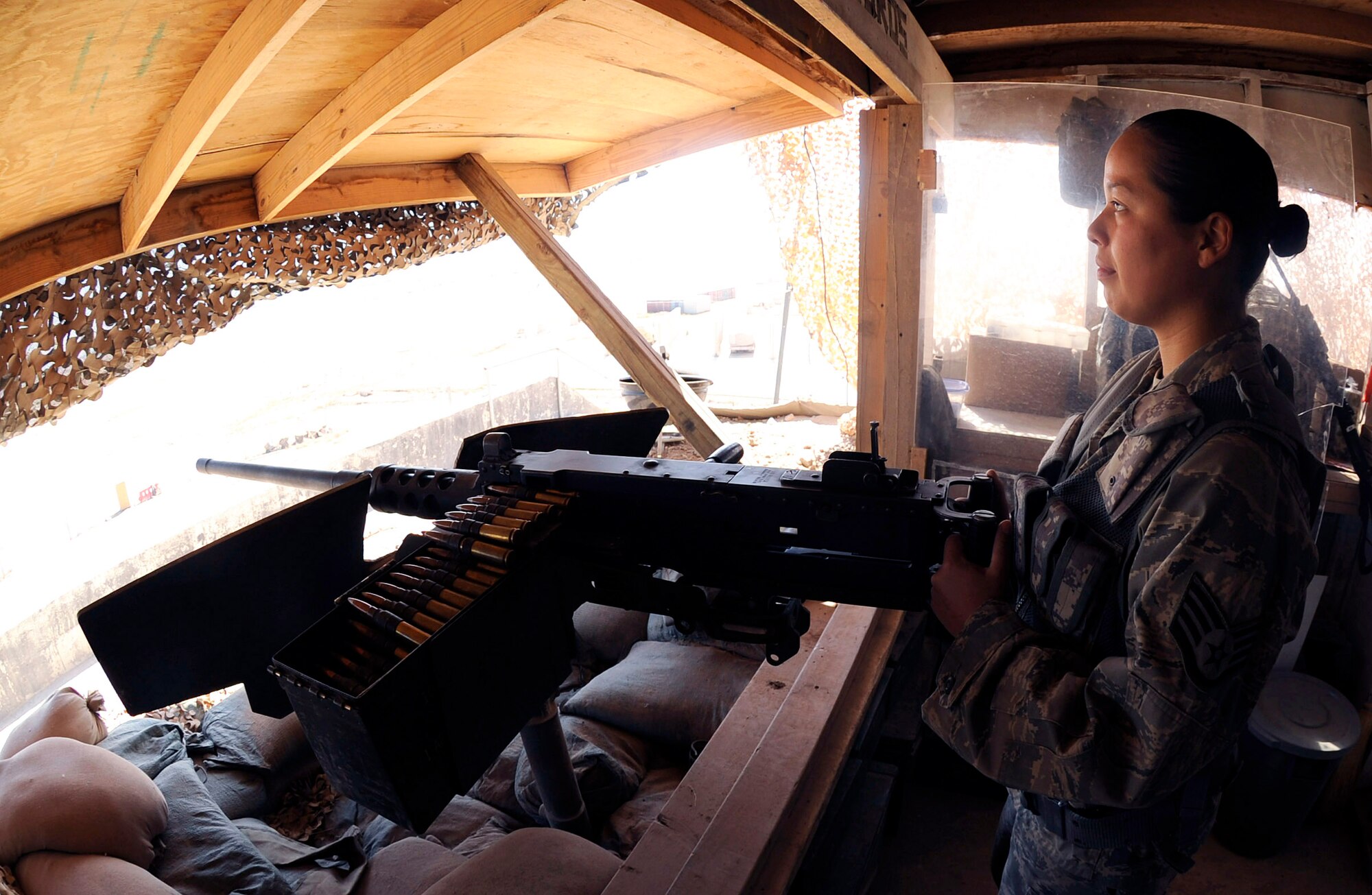Staff Sgt. Vida Reveles observes the flightline at Sather Air Base, Iraq, while manning a .50 caliber machine gun March 26. Sergeant Reveles provides [a]show of force for the base making sure that no unauthorized personnel are allowed on the base. Sergeant Reveles is one of a few security forces members qualified on the .50 cal here. Sergeant Reveles is a 447th Expeditionary Security Forces Squadron heavy weapons operator. (U.S. Air Force photo/Senior Airman Jacqueline Romero)