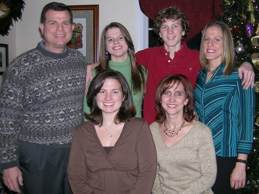 Col. Dwyer Dennis (standing left), 551st Electronic Systems Wing commander, and Mrs. Tammy Dennis (seated right) pose with their children (back row from left) Alison, Derek, Cherie and (seated left) Amanda last year. Colonel and Mrs. Dennis were recently named AFMC's nominee for the General and Mrs. Jerome F. O'Malley award. (Courtesy photo)
