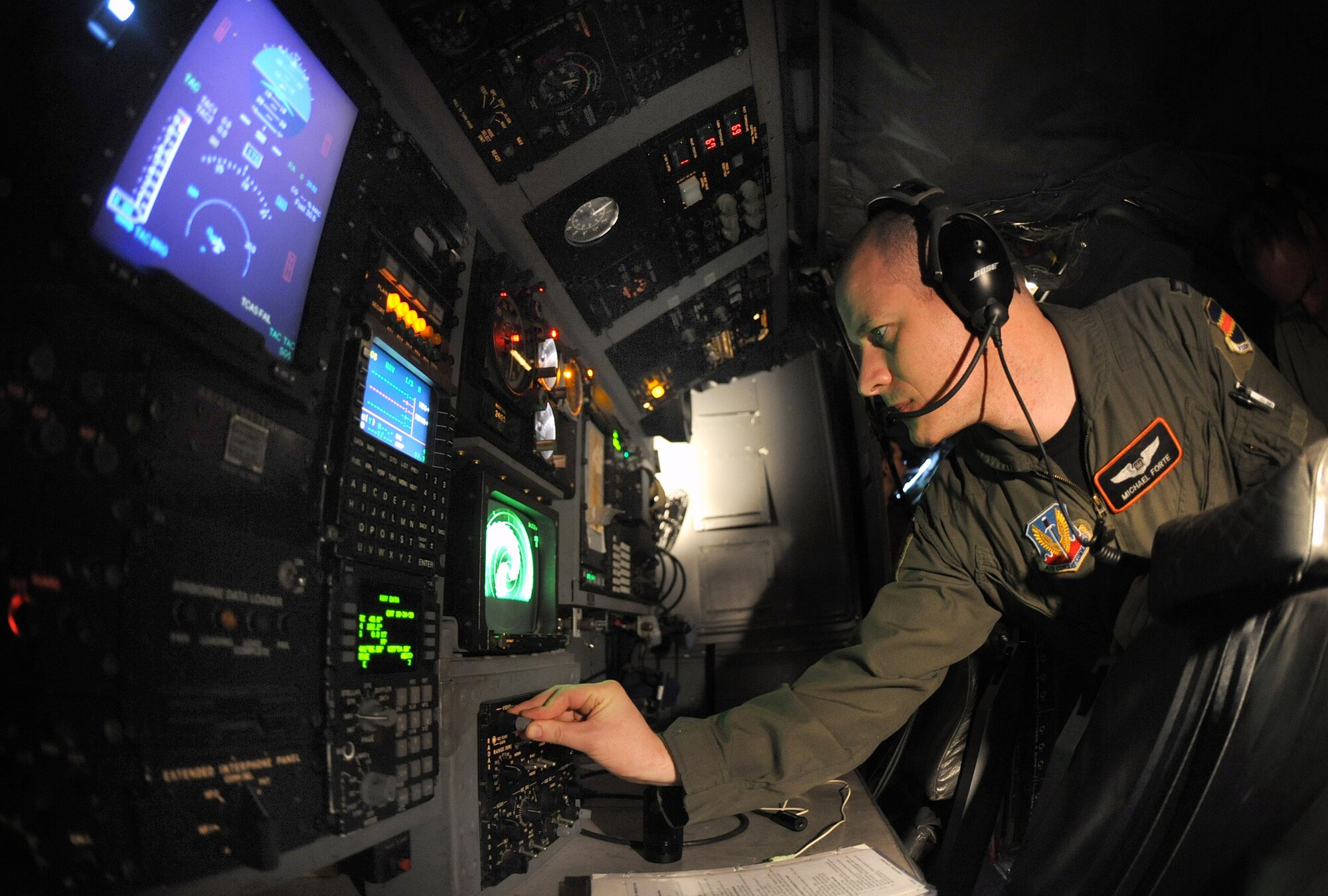 OFFUTT AIR FORCE BASE, Neb.-- Capt. Michael Forte, navigator with the 338th Combat Training Squadron, adjusts the radar screen resolution as part of a pre-flight checklist on a manual gear extension training held on a RC-135/Rivet Joint aircraft parked inside Dock 2 of the Bennie Davis Maintenance Facility, March 25.  This training is crucial for aircrew members to master if the landing gear fail to electronically lower.

 U.S. Air Force Photo by Josh Plueger  