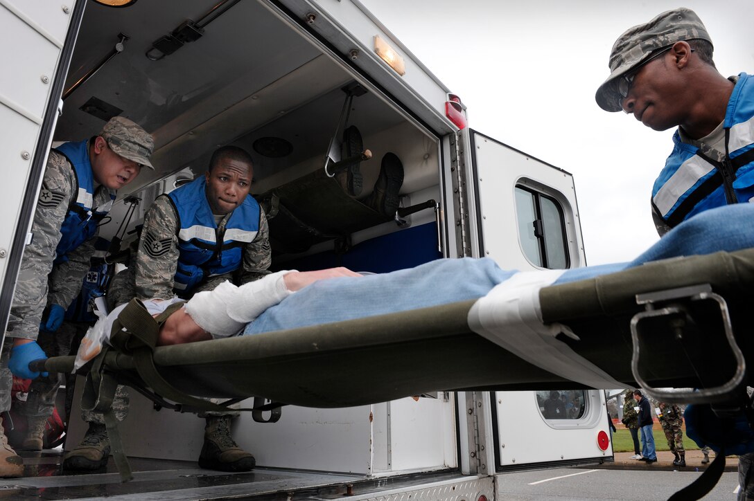 LANGLEY AIR FORCE BASE, Va. -- Airmen from the 1st Medical Group transport a wounded patient during an All Hazards Response Training Exercise here on March 26.  The exercise tested the ability to provide medical care to mass casualties during a simulated chemical attack.  (U.S. Air Force photo/Senior Airman Vernon Young)