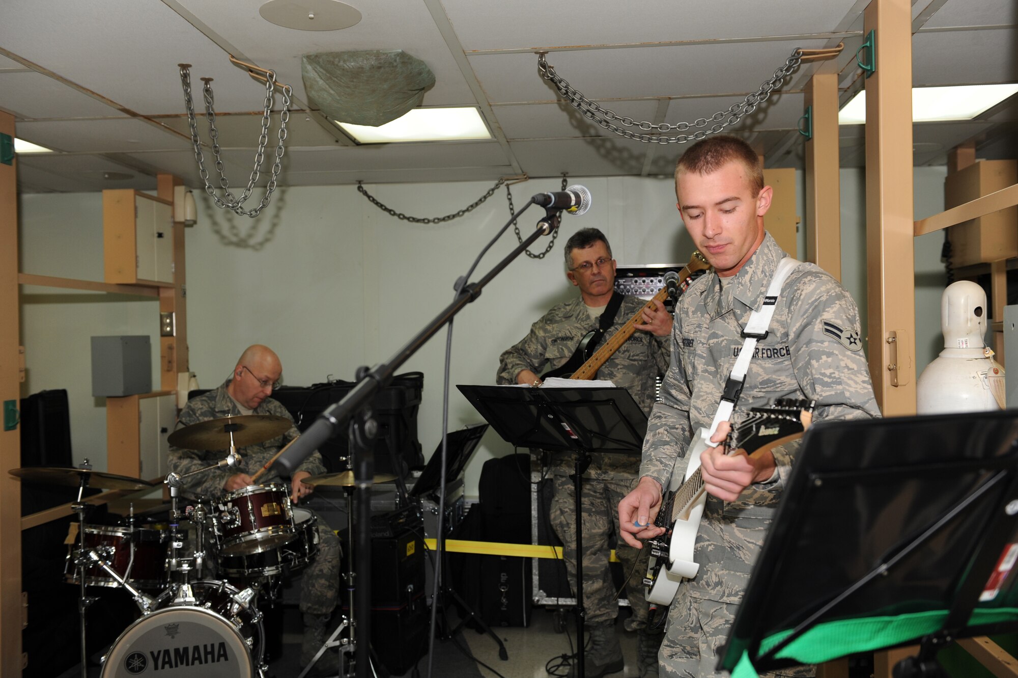 USNS COMFORT T-AH 20 --  Members of the Star Lifter Rock Band rehearse in preparation for their deployment on the USNS Comfort March 25.  The Comfort is deploying for the Continuing Promise 2009 mission which provides humanitarian aid to partner nations in the U.S. Southern Command area of focus.  (U.S. Air Force photo by Senior Airman Jessica Snow)
