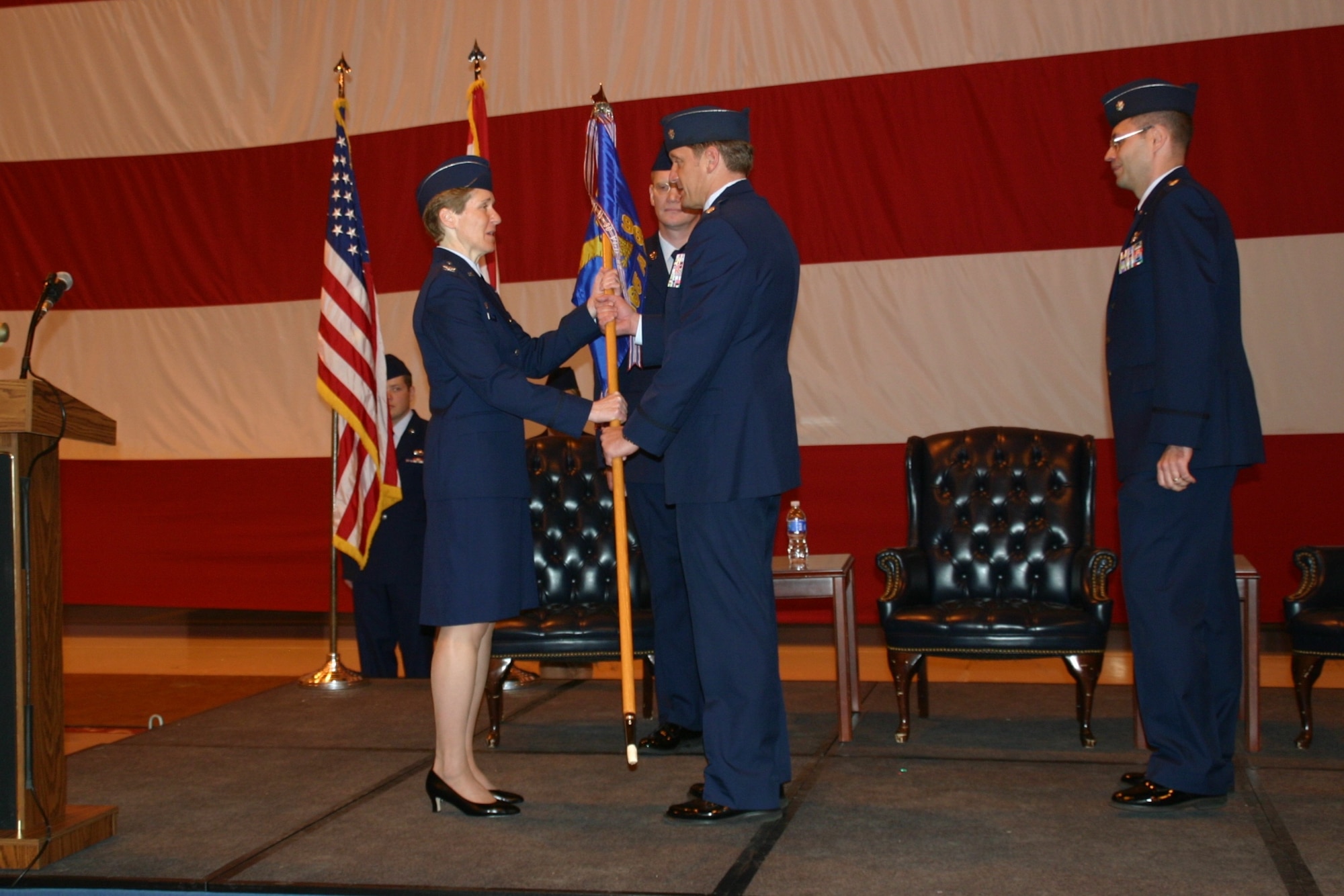 Lieutenant Col. Jimmy Warren assumes command of the 965th Airborne Air Control Squadron March 23 as he receives the ceremonial guide-on from Col. Patricia Hoffman, commander, 552nd Air Control Wing.