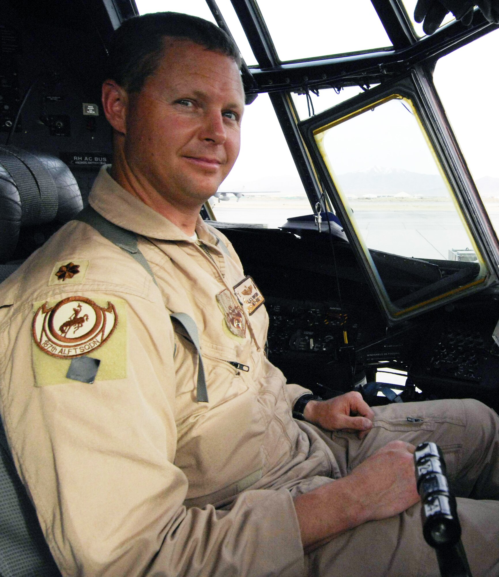 Major Alan Brown sits in a C-130 Hercules before a mission March 21 at Bagram Airfield, Afghanistan. Major Brown is an amputee C-130 pilot deployed with the 774th Expeditionary Airlift Squadron from the 187th Airlift Squadron of the Wyoming Air National Guard. He lost his leg in a hunting accident 10 years ago, and after seven years he regained his qualifcations to fly. (U.S. Air Force photo/Senior Airman Erik Cardenas) 
