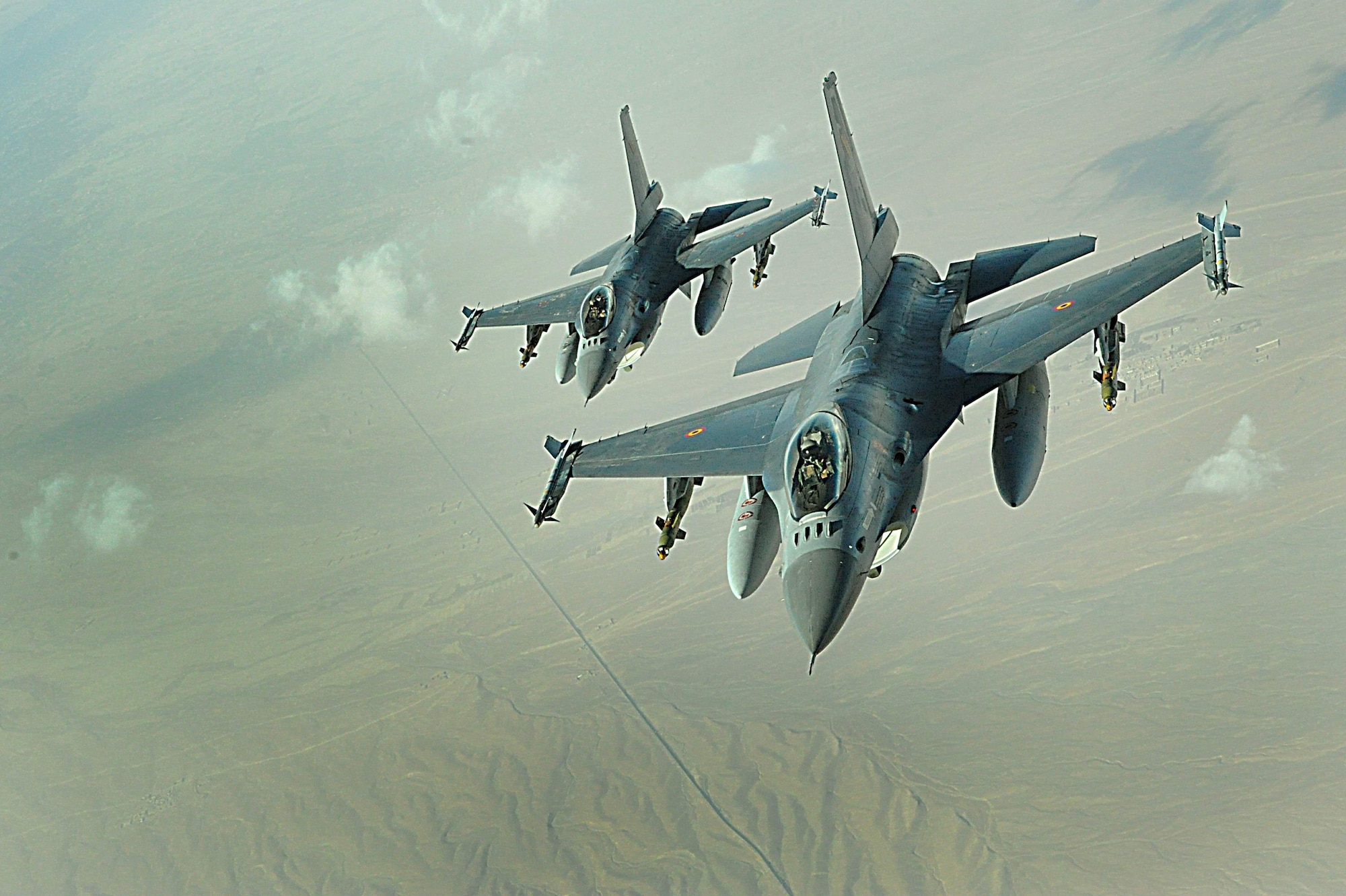 F-16 Fighting Falcons fly over Southwest Asia. The F-16 is highly maneuverable and has proven itself in air-to-air combat and air-to-surface attack. (U.S. Air Force photo)