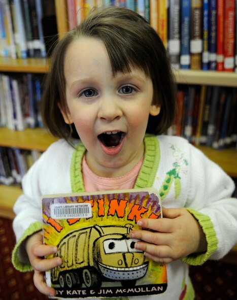 Excitement lights up the face of military dependant Vera Ingersoll as she discovers a book about a garbage truck, titled "I Stink" at the RAF Mildenhall Library, March 25, 2009.  The Mildenhall library carries books for all age groups ranging from toddlers to adults.  (U.S. Air Force photo by Senior Airman Christopher L. Ingersoll)