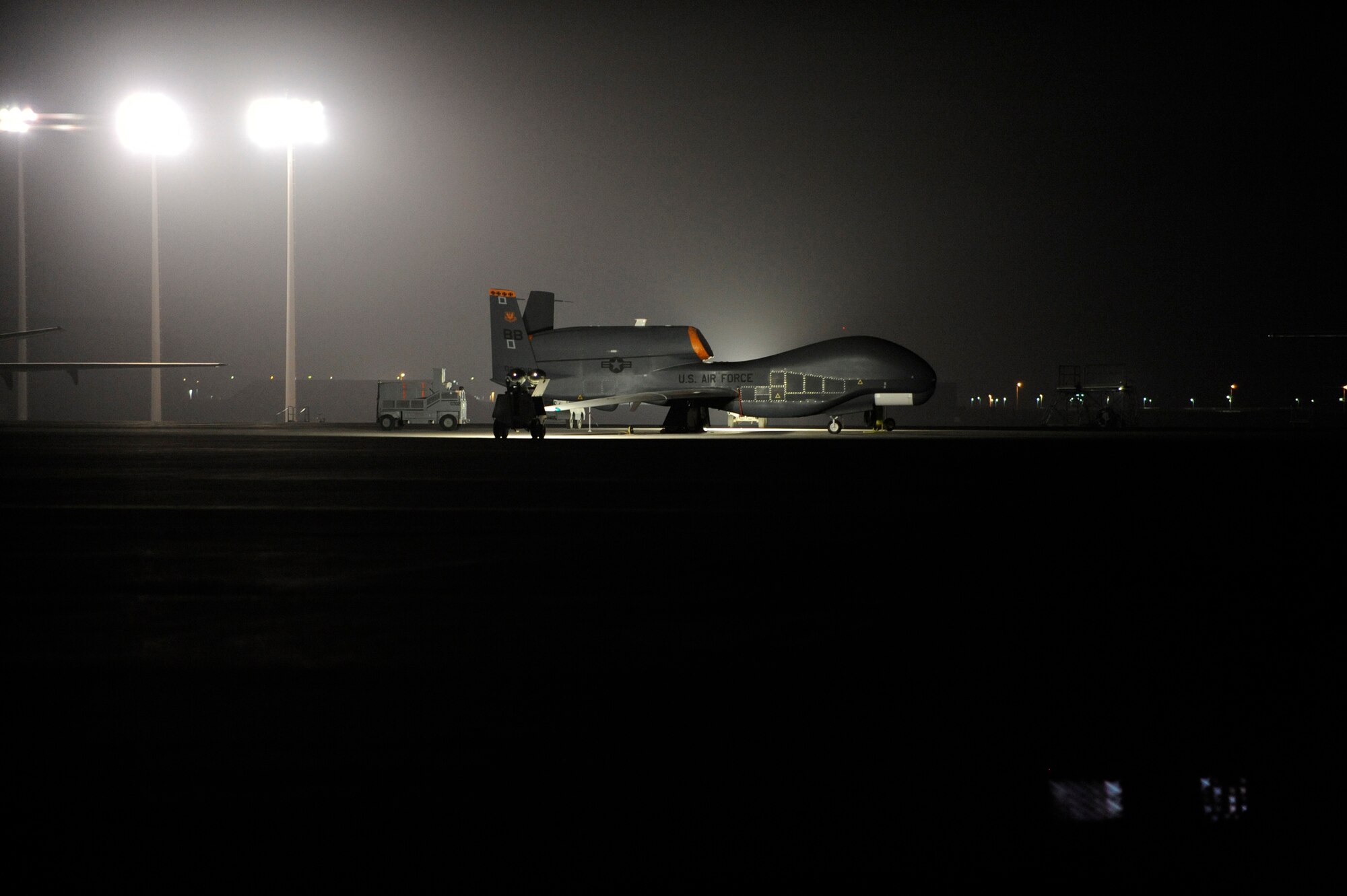 SOUTHWEST ASIA -  An RQ-4 Global Hawk stands ready on the flightline of the 380th Air Expeditionary Wing, Mar 24. The 380th AEW flies refueling and reconnaissance missions 24/7 in support of Operations Iraqi and Enduring Freedom and Joint Task Force Horn of Africa. (U.S. Air Force photo by Senior Airman Brian J. Ellis) (Released)