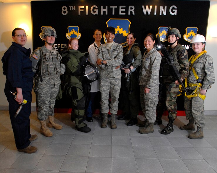 Air Force and Army members from Kunsan Air Base, Republic of Korea, pose for a group photo in honor of Women's History Month, March 27, 2009. (U.S. Air Force Photo by SSgt Jason Colbert)