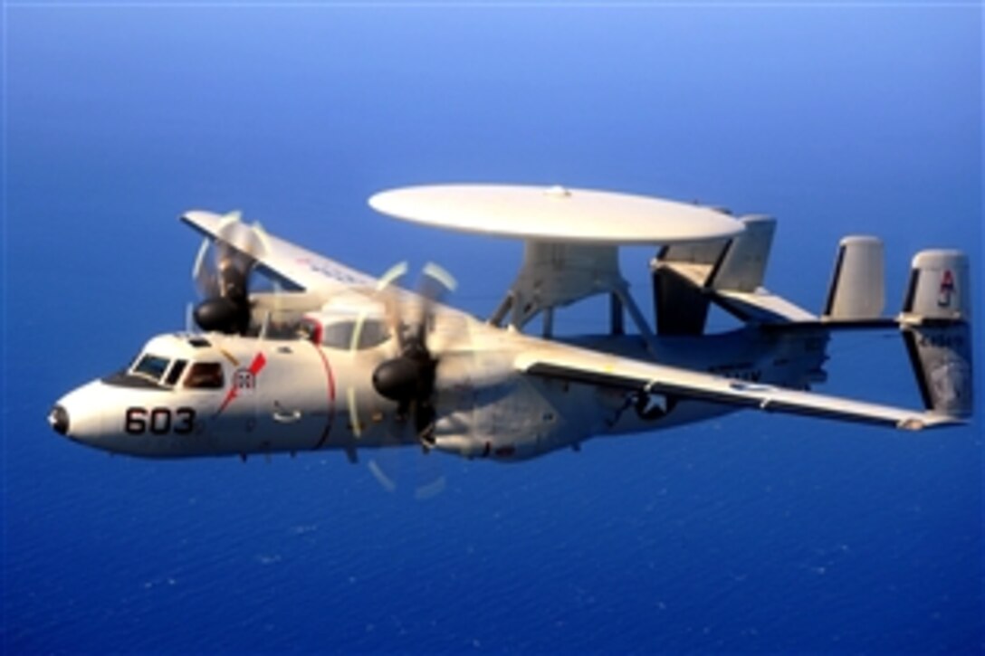 A U.S. Navy aviation crew aboard an E-2C Hawkeye flies over the Pacific Ocean in the U.S. 5th Fleet area of responsibility March 25, 2009. The crew and aircraft are assigned to the "Bear Aces" of Carrier Airborne Early Warning Squadron 124.