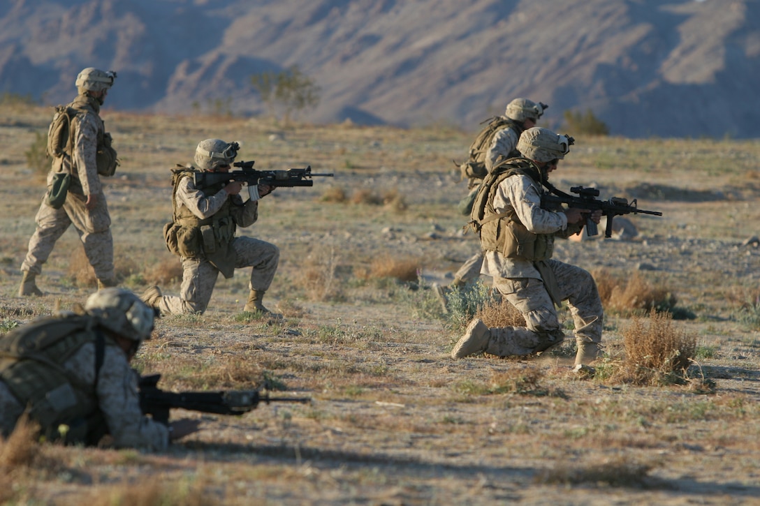 Marines rush nearly one half-mile while conducting live fire squad rushes here March 27. Marines bound, moving to and from the ground while making their advancements, something most found to be physically exhausting. This was the first time the Marines of with Company E, Battalion Landing Team 2nd Battalion, 4th Marine Regiment conducted this type of live fire exercise during their workups for their upcoming deployment with the 11th Marine Expeditionary Unit.