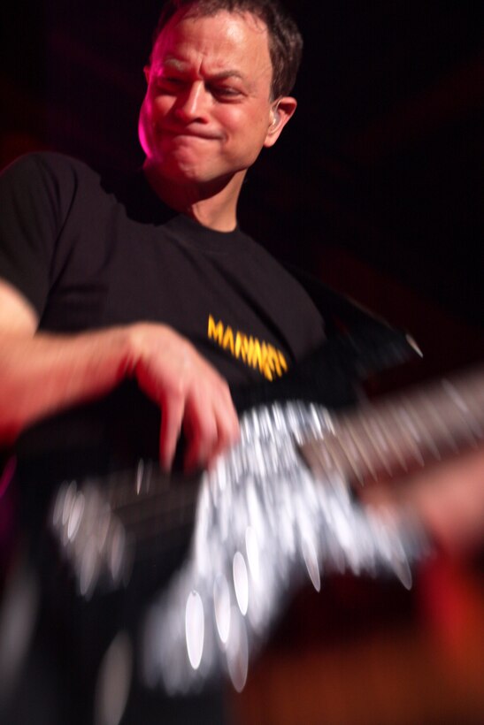 Gary Sinise, the star of the hit television show CSI: New York, and bass guitar player with the Lt. Dan Band, wails on his guitar during their show March 28 night at the Sunset Cinema.::r::::n::  ::r::::n::