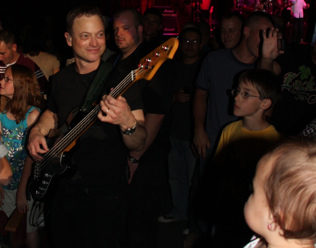 Gary Sinise, the co-star in Apollo 13, and bass guitar player for the Lt. Dan Band, takes a walk through the crowd during their show March 28 night at the Sunset Cinema.