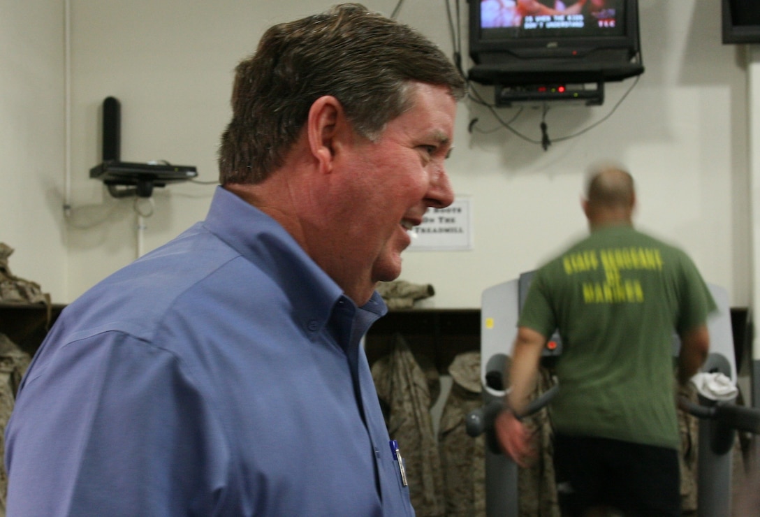 Ken Calvert, a member of the United States House of Representatives since 1993, talks with a tour member in Camp Wilson’s Fitness Center during a tour of the Combat Center’s training areas March 28.