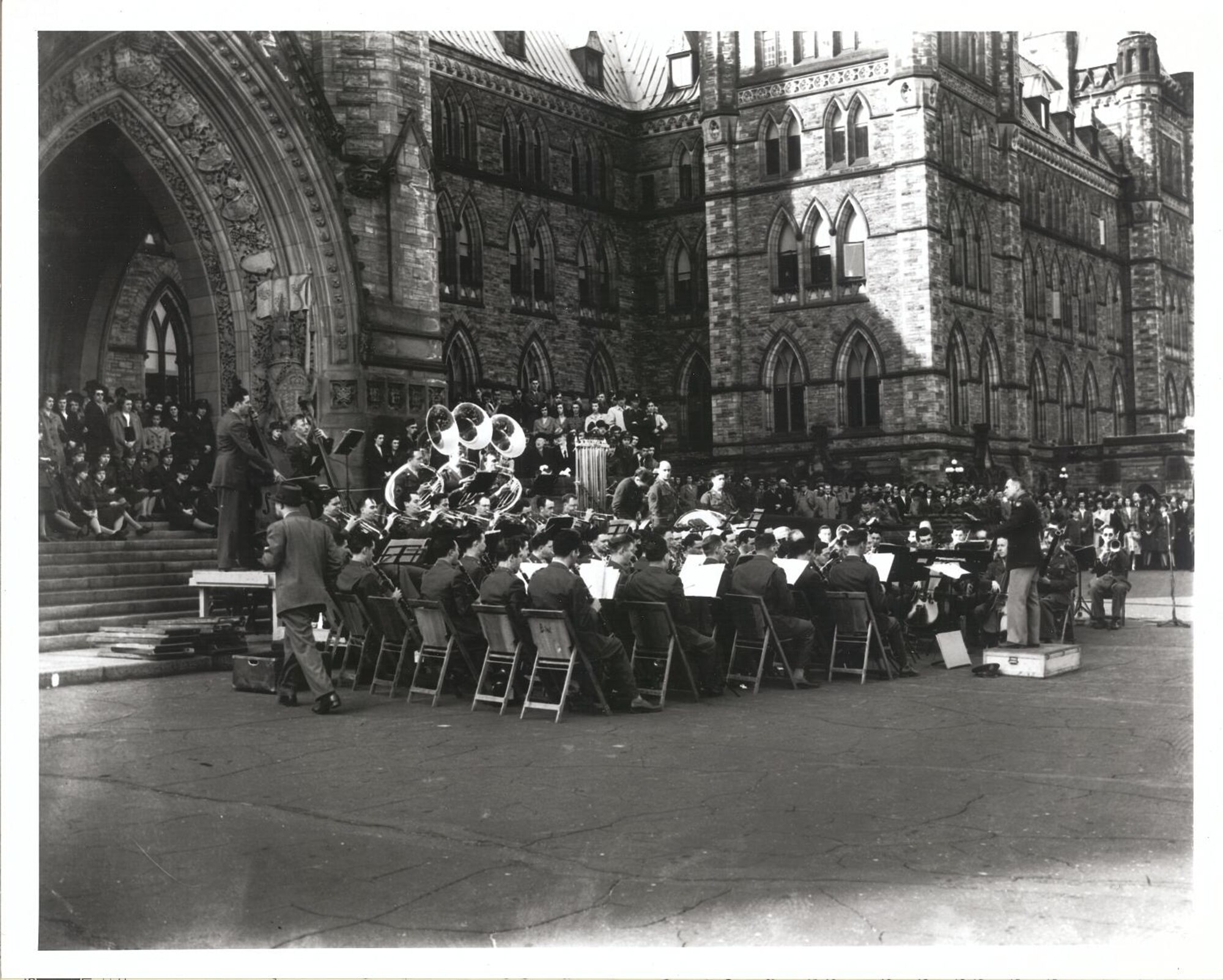 This photo was taken while the Band was TDY to Ottawa, Canada in 1944. It was taken by Senior Master Sgt. Oscar McGregor (USAF, Ret., deceased) who documented the location as being in front of the Parliament building in Ottawa. The five city tour helped raise funds for the Canadian War effort. 