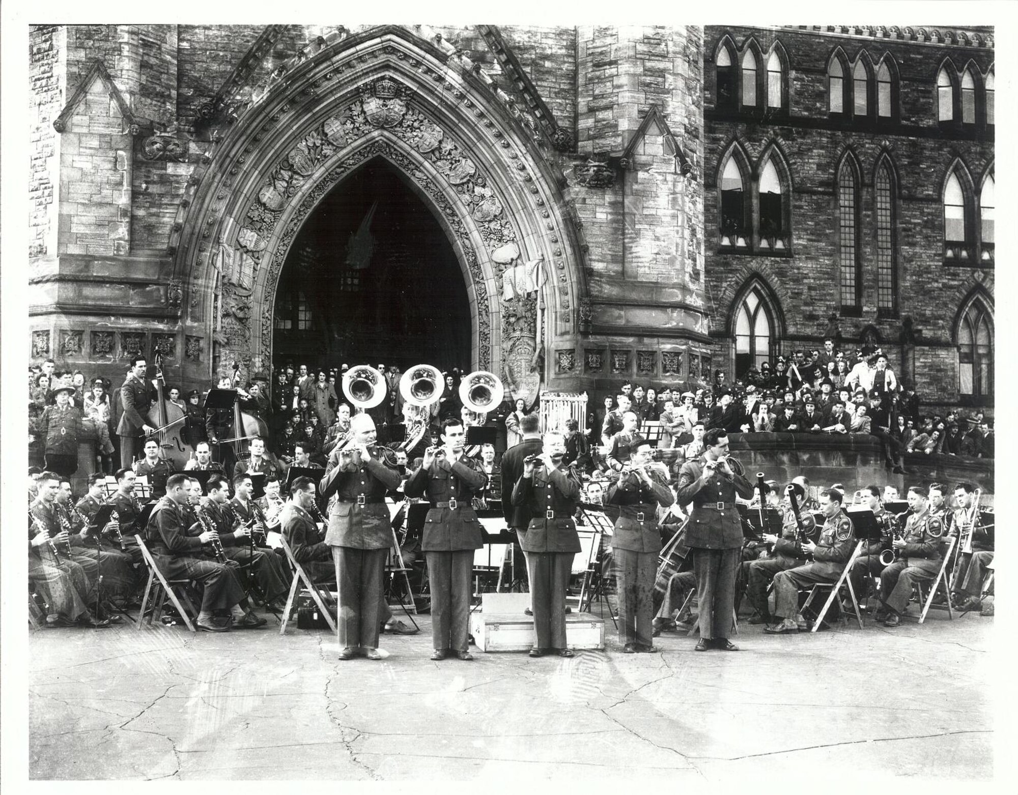 This photo was taken while the Band was TDY to Ottawa, Canada in 1944. It was taken by Senior Master Sgt. Oscar McGregor (USAF, Ret., deceased) who documented the location as being in front of the Parliament building in Ottawa. The five city tour helped raise funds for the Canadian War effort.