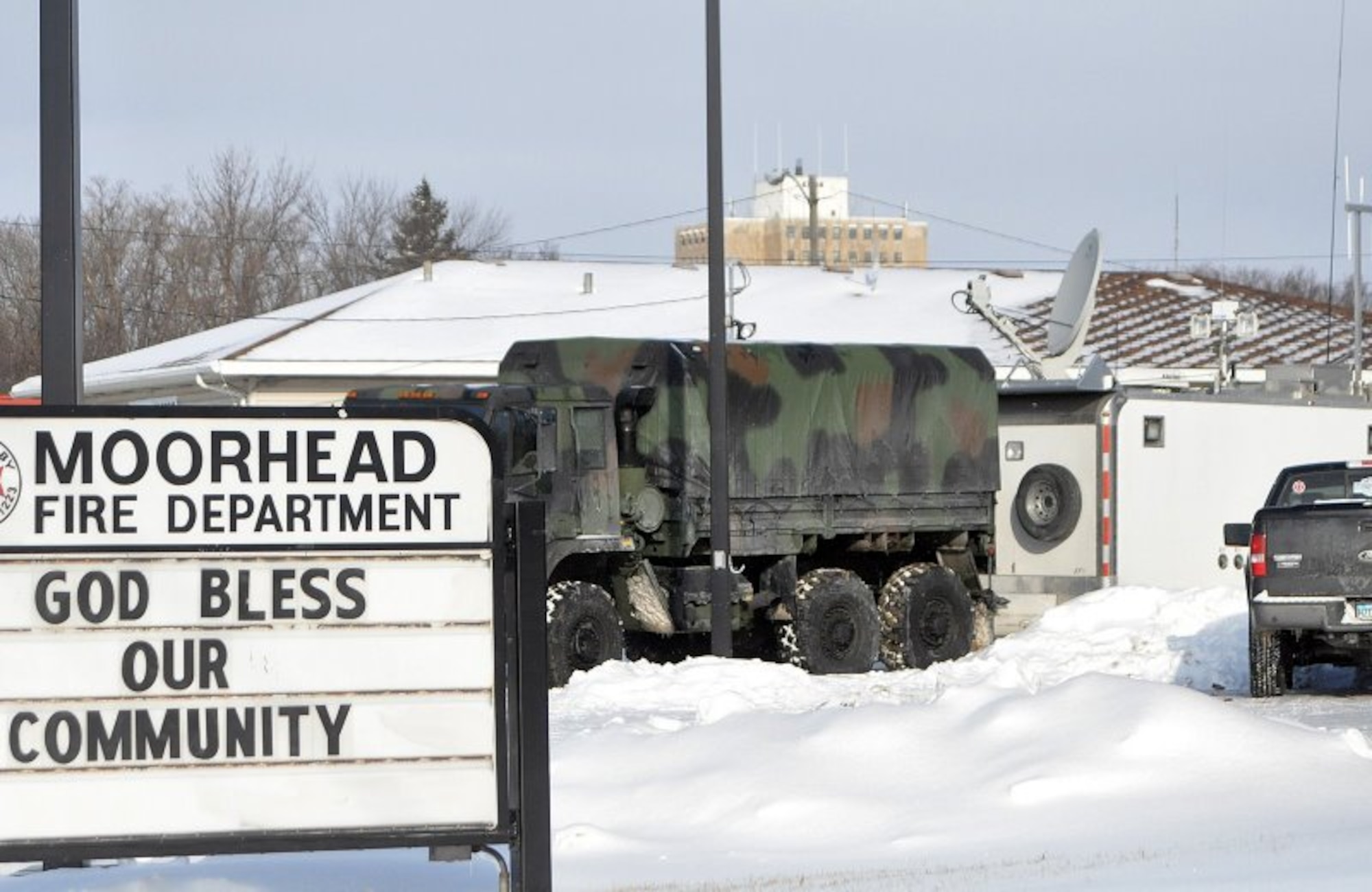 One of Minnesota  Joint Communications Platform (JCP), behind military vehicle, is deployed to Moorhead, Minn. during the Red River flooding emergency of March 2009. JCPs are critical for providing military and commercial internet access at the incident command site.