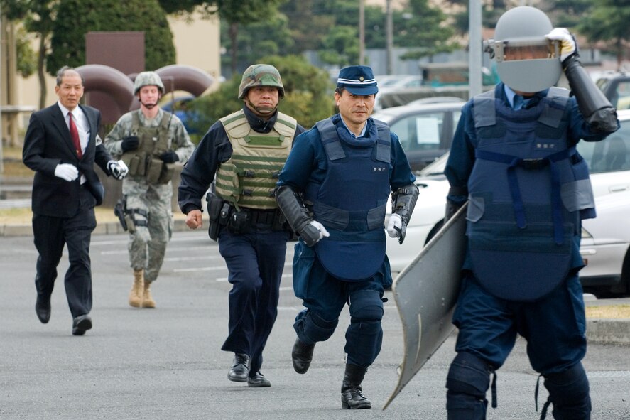 YOKOTA AIR BASE, Japan -- The 374th Security Forces Squadron conducted its first-ever joint response training exercise with members of the Japanese National Police-Fussa Division, March 27. (U.S. Air Force photo/Osakabe Yasuo)