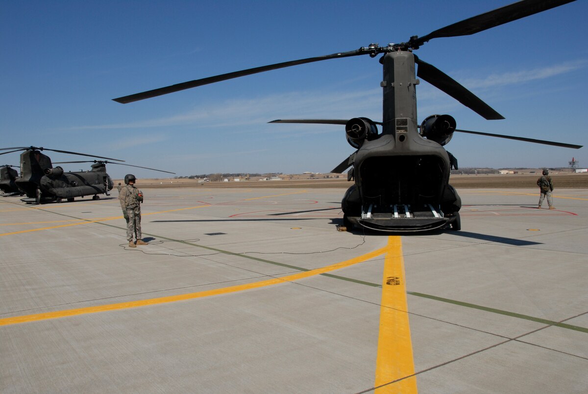 Four Chinooks, from Fort Riley, Kansas, take off from Joe Foss field, Sioux Falls, S.D. after landing for fuel and food. The crews took off loaded with troops and equipment headed for the devastated areas in North Dakota affected by severe flooding.