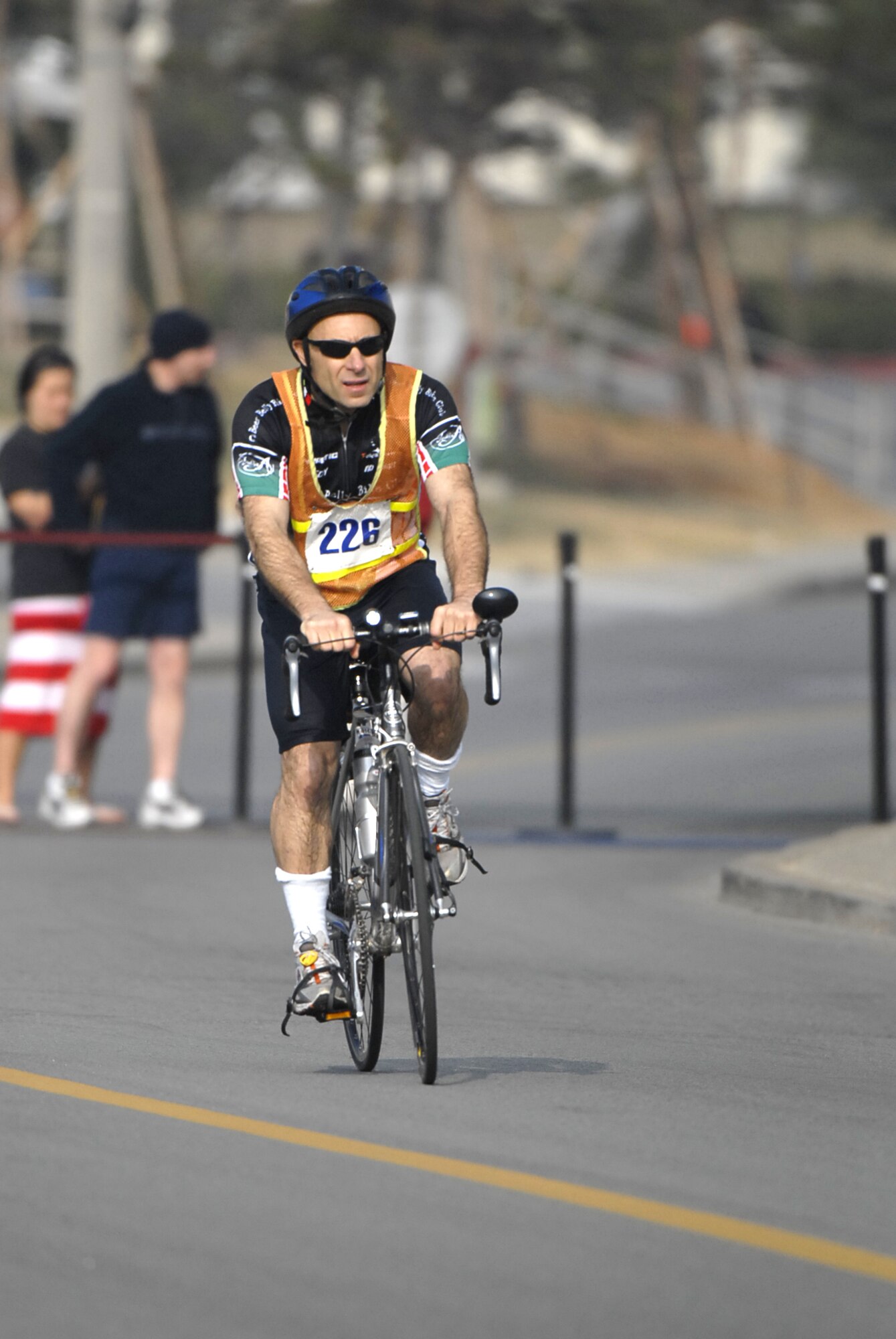 Tech. Sgt. Alan Brender treks along during the bicycle portion of the United States Army Garrison Humphreys Sprint Triathlon March 21st. Sergeant Brender is an emergency manager assigend to Seventh Air Force at Osan Air Base, Republic of Korea. (U.S. Air Force photo/Master Sgt. Marlin Zimmerman)