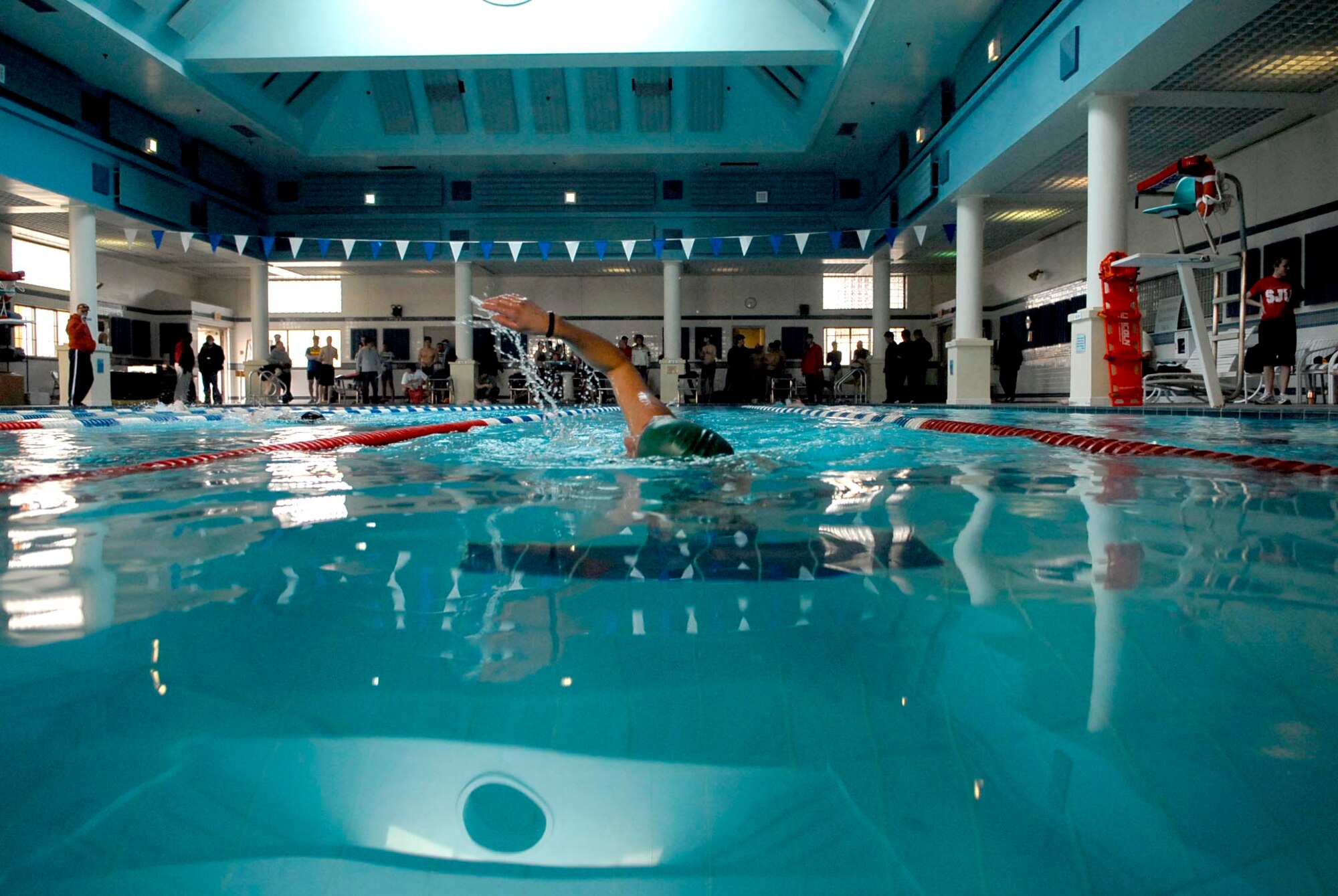 Capt Rebecca Gross races towards the far end of the swimming pool during the United States Army Garrison Humphreys Sprint Triathlon March 21st.  Capt Gross is a readiness officer for the 607th Air Operations Center at Osan Air Base, Republic of Korea. (U.S. Air Force photo/Master Sgt. Marlin Zimmerman)