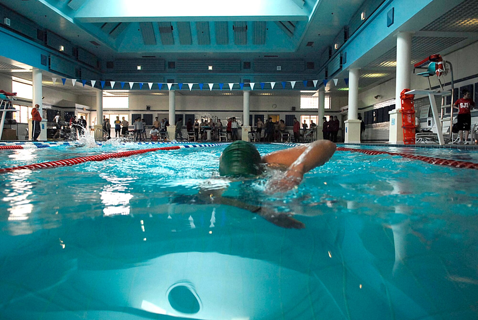 Capt Rebecca Gross races towards the far end of the swimming pool during the United States Army Garrison Humphreys Sprint Triathlon March 21st. Capt Gross is a readiness officer for the 607th Air Operations Center at Osan Air Base, Republic of Korea. (U.S. Air Force photo/Master Sgt. Marlin Zimmerman)