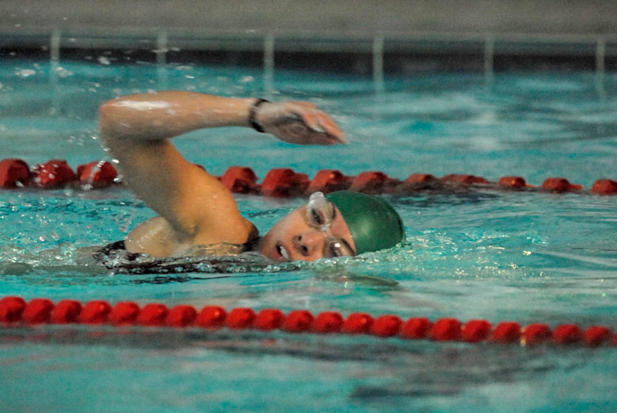 Capt Rebecca Gross competes against other Department of Defense members during the swimming portion of the United States Army Garrison Humphreys Sprint Triathlon March 21st. Capt Gross is a readiness officer for the 607th Air Operations Center at Osan Air Base, Republic of Korea. (U.S. Air Force photo/Master Sgt. Marlin Zimmerman)