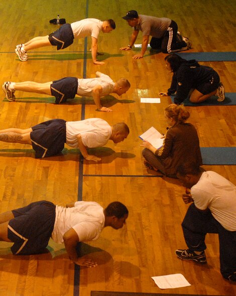 Fitness testing specialists from the Health and Wellness Center count push-ups for Airmen taking the physical fitness test March 31 at the O'Connor gym. Under directions from Pacific Air Forces leadership, the HAWC is now the focal point for all fitness testing.
(U.S. Air Force official photo/Staff Sgt. Nestor Cruz)