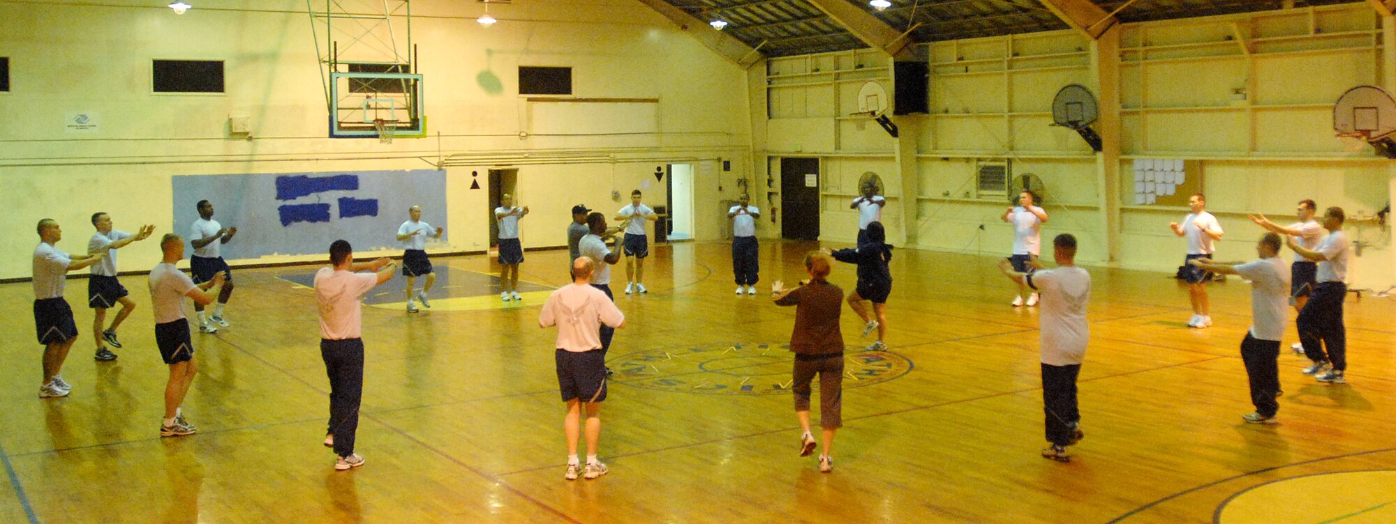 Fitness testing specialists from the Health and Wellness Center lead Airmen through warm-up exercises prior to their fitness test March 31 at the O'Connor gym. Under direction from Pacific Air Forces leadership, the HAWC is now the focal point for all fitness testing.
(U.S. Air Force official photo/Staff Sgt. Nestor Cruz)
