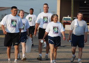 SOTO CANO AIR BASE, Honduras - Nearly 150 men and women from Joint Task Force-Bravo celebrated Women's History Month today by taking part in a "Save our Planet" walk around the base.  Guest speaker Maj. Nancy Gormley, Army Forces executive officer, gave opening remarks then lead the group on a  walk around the base to learn about the local trees and pick up trash.  (U.S. Air Force photo/Tech. Sgt. Rebecca Danét)
