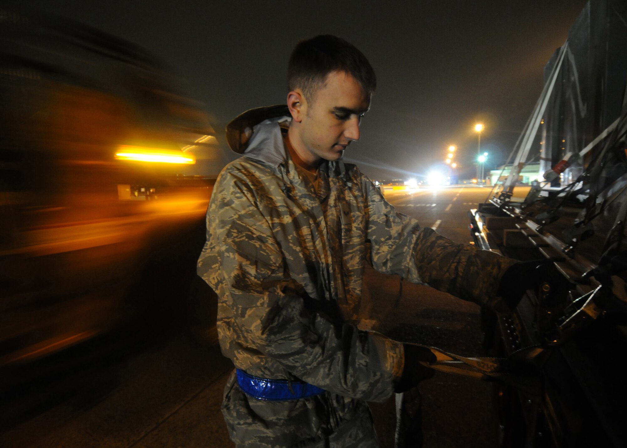 YOKOTA AIR BASE, Japan -- Senior Airman Steven Tawney, 374th Logistics Readiness Squadron secures a load of liquid nitrogen on a flat-bed trailer March 31 during Phase I of  Exercise Beverly Morning 09-03. Yokota is conducting an exercise March 30 through April 3 to maintain operational readiness. (U.S. Air Force photo/ Senior Airman Veronica Pierce)
