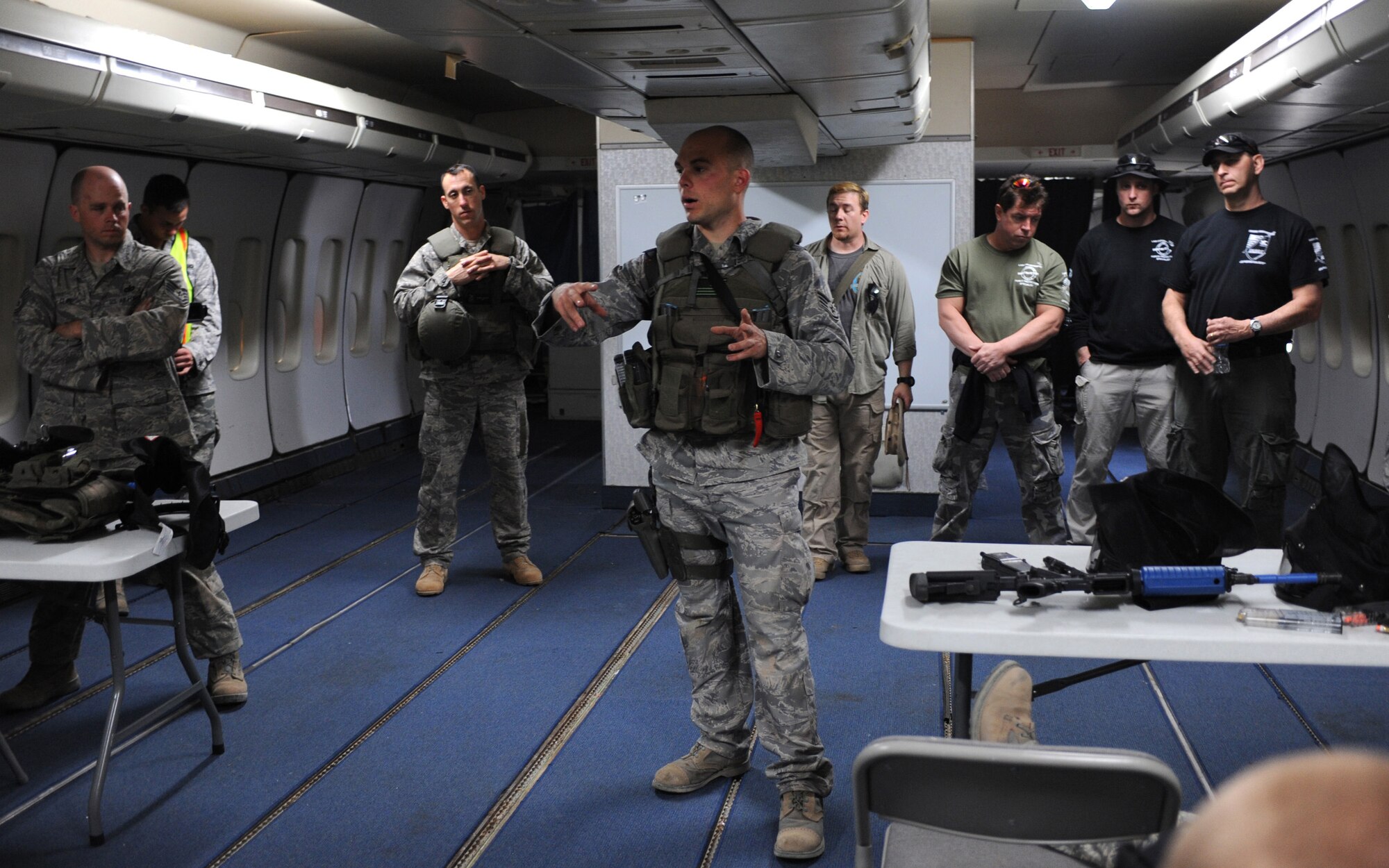 CANNON AIR FORCE BASE, N.M. -- Staff Sgt. John Zelonis, 27th Special Operations Security Forces Squadron, speaks to the security forces Airmen that attended a week-long training exercise in Roswell, N.M., March 20. Sergeant Zelonis, one of two team leaders, discussed the performance of the teams after the final event of the week, which consisted of securing a mock village before returning to an airplane to depart.(U.S. Air Force photo/Airman 1st Class Evelyn Chavez)