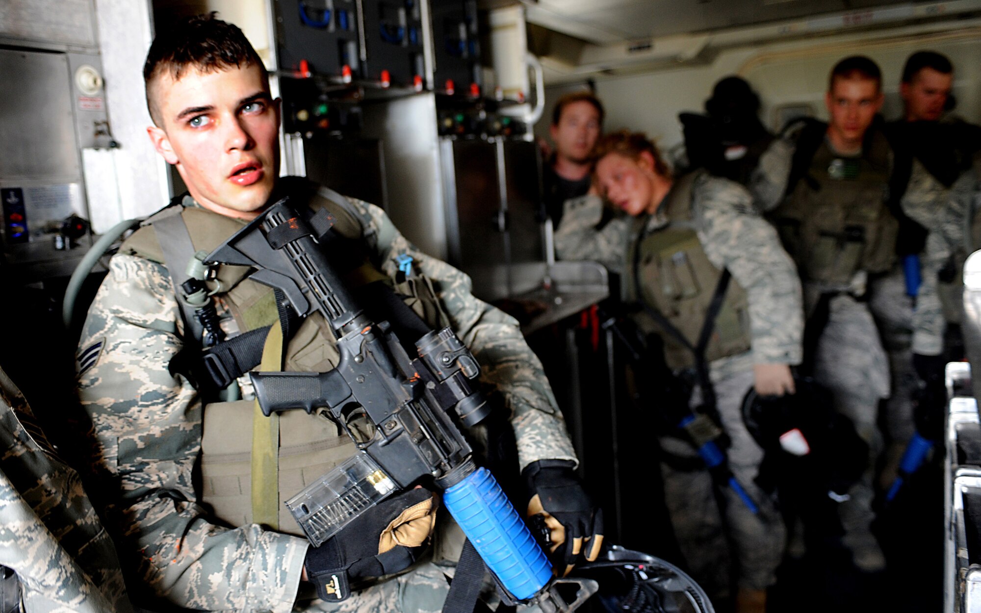 CANNON AIR FORCE BASE, N.M. -- Senior Airman Shawn Keown, 27th Special Operations Security Forces Squadron, rests after completing the final exercise of week-long training March 20. Thirteen Airmen participated in the training that consisted of hand-to-hand combat, weapons training and more. (U.S. Air Force photo/Airman 1st Class Evelyn Chavez)