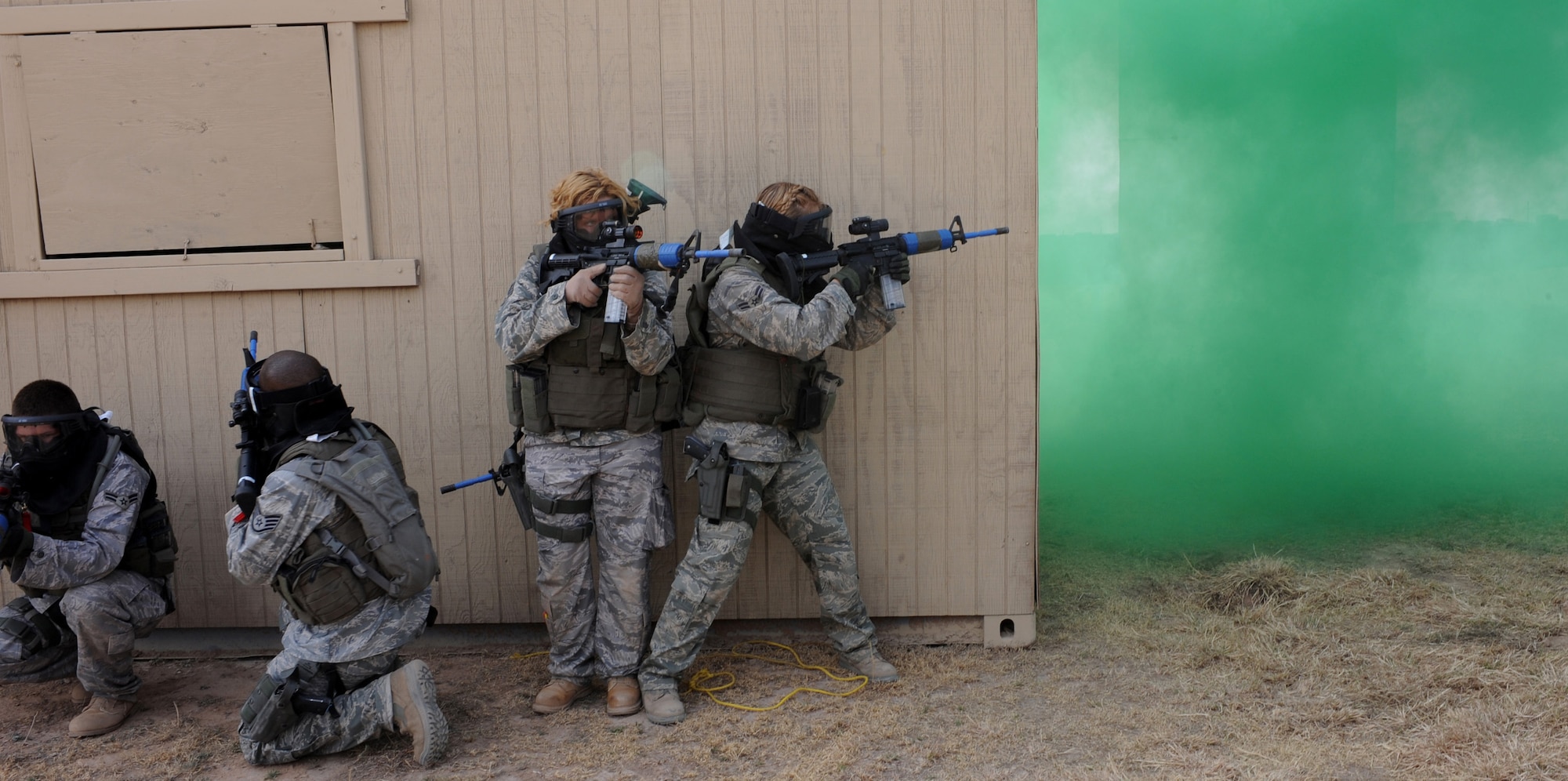 CANNON AIR FORCE BASE, N.M. -- Security forces Airmen watch the corner of a building while securing a hostile "village" March 20 during week-long training in Roswell, N.M. Taking the "village" was the final event of the week after training in different areas including hand-to-hand combat, weapons training, and night-vision driving. (U.S. Air Force photo/Airman 1st Class Evelyn Chavez)