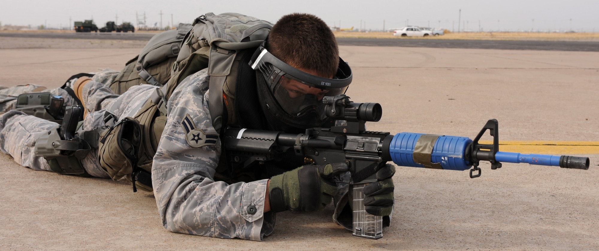 CANNON AIR FORCE BASE, N.M. -- Airman 1st Class Anthony Arenas, 27th Special Operations Security Forces Squadron, secures the perimeter of an aircraft March 20 during training in Roswell, N.M. After securing the perimeter of the aircraft, two six-man security forces teams gained control of a "village" before returning to the aircraft. The event was the culmination of a week of training. (U.S. Air Force photo/Airman 1st Class Evelyn Chavez)