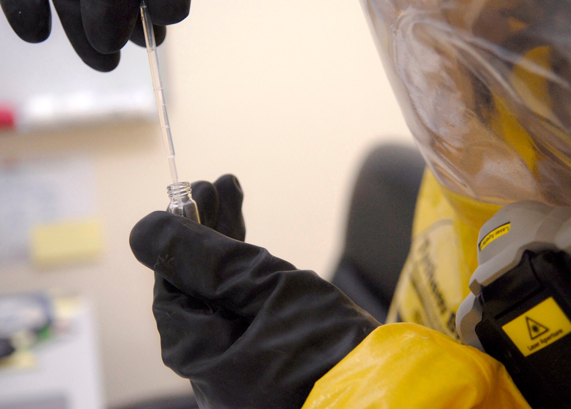 Staff Sgt. Trevor Fettig prepares to analyze a liquid sample for contamination during a unit exercise March 27 at an air base in Southwest Asia.  Sergeant Fettig, a readiness and emergency management journeymen with the 379th Expeditionary Civil Engineer Squadron, hails from Lompoc, Calif., and is deployed from Travis Air Force Base, Calif.  (U.S. Air Force photo/Senior Airman Andrew Satran)