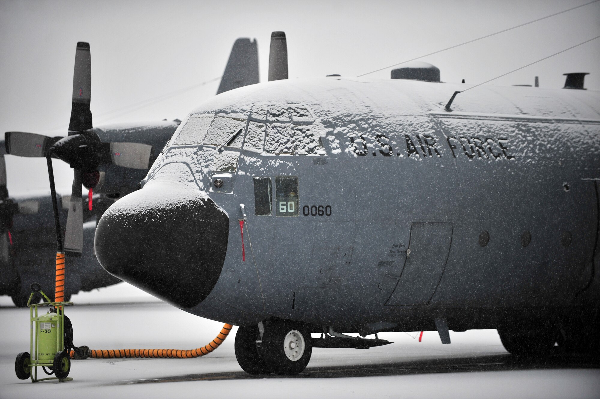 A C-130 Hercules from Kulis Air National Guard Base sits on Eielson Air Force Base's runway, Mar. 27, 2009. The aircraft evacuated from Kulis ANGB during the recent Mount Redoubt eruptions off the coast of Alaska. (U.S. Air Force photo/ Airman 1st Class Willard E. Grande II)