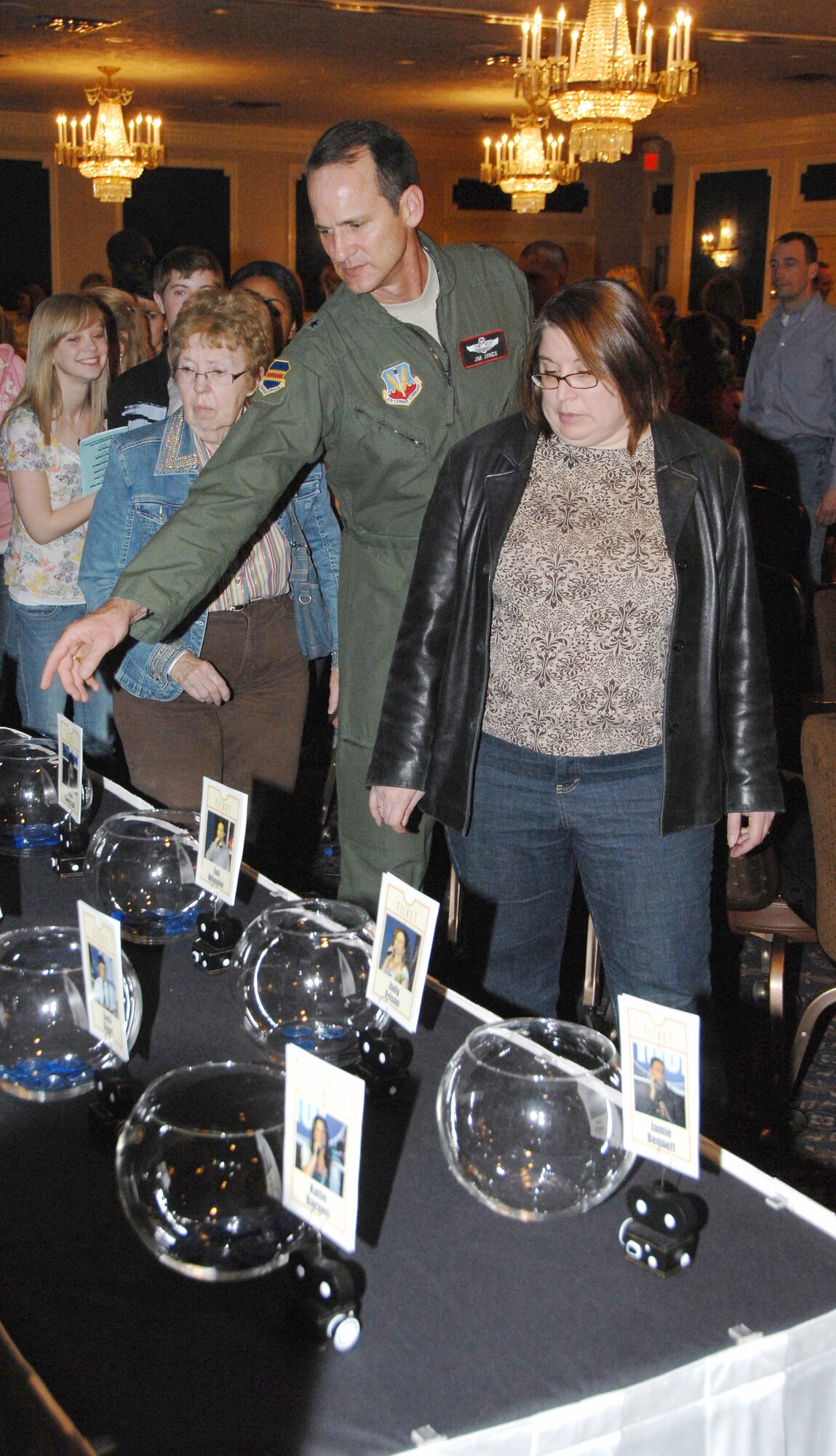 OFFUTT AIR FORCE BASE, Neb. -- 55th Wing Commander Brig. Gen. James J. Jones and other audience members cast their votes at the finals of the 2009 Offutt Idol competition, held at the Patriot Club March 20. 
Air Force Photo by Dana P. Heard