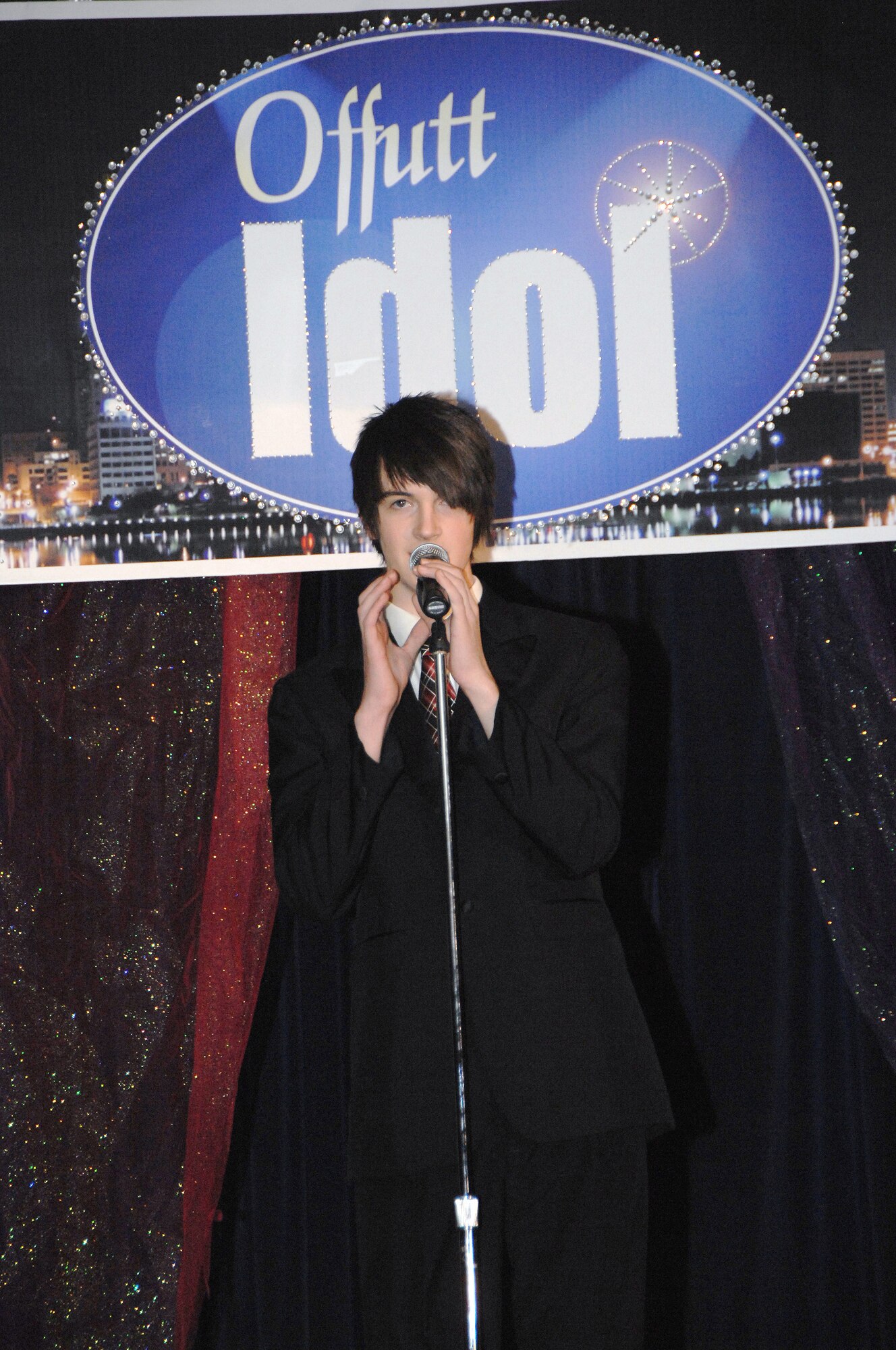 OFFUTT AIR FORCE BASE, Neb. -- Sam Swerczek performs during the finals of the 2009 Offutt Idol competition  held at the Patriot Club March 20. Mr. Swerczek won the competition with his rendition of "Feeling Good."   
Air Force Photo by Dana P. Heard