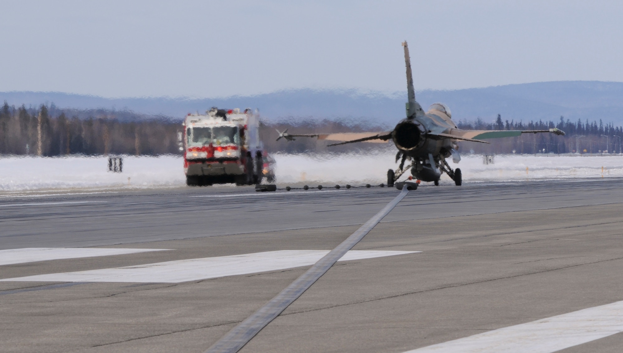 An F-16 Fighting Falcon, 18th Aggressor Squadron, sits on the runway after engaging an arresting cable at a speed of 124 knots March 25, 2009, Eielson Air Force Base, Alaska. The cable is similar to the ones used on Naval Aircraft carriers and must be certified once a year to ensure proper functioning in the event of an emergency. (U.S. Air Force photo/Airman 1st Class Laura Max)