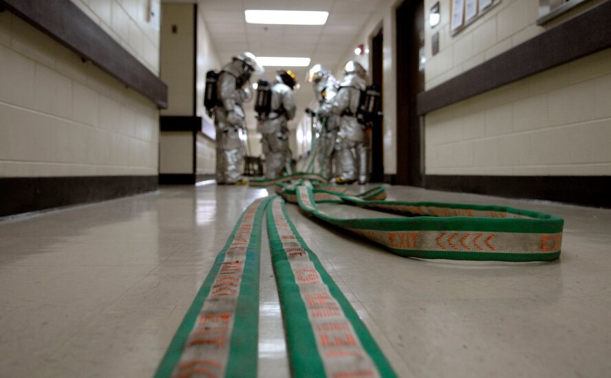 Firefighters from the 51st Civil Engineering Squadron make their way through the halls of Osan Air Base Hospital during a simulated fire March 30 during Operational Readiness Exercise Beverly Bulldog 09-02. The pre-scheduled exercise is designed to help the 51st Fighter Wing prepare for the Operational Readiness Inspection in April. (U.S. Air Force photo/Staff Sgt. Brian Ferguson)