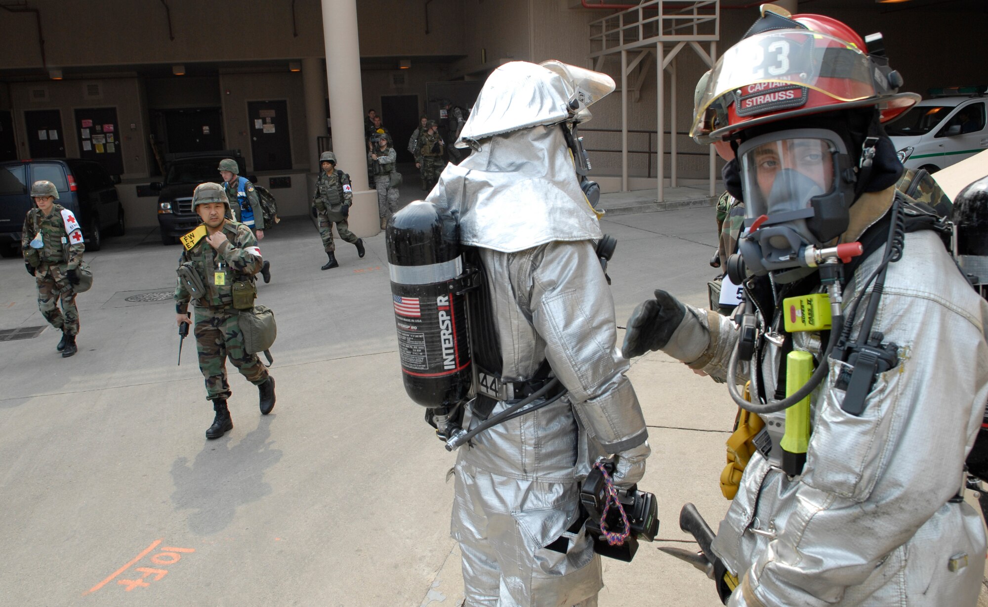 Firefighters from the 51st Civil Engineering Squadron evaluate the situation before entering the Osan Air Base Hospital during a simulated fire March 30 during Operational Readiness Exercise Beverly Bulldog 09-02.  The pre-scheduled exercise is designed to help the 51st Fighter Wing to prepare for their Operational Readiness Inspection in April. (U.S. Air Force photo/Staff Sgt. Brian Ferguson)