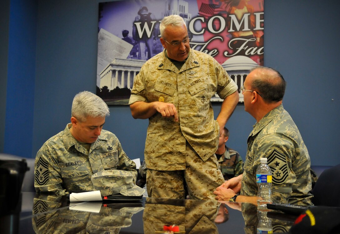 Chief Master Sgt. Pat Battenberg,  Command Chief Master Sergeant, 79th Medical Wing, speaks with U.S. Navy Command Master Chief Robert Elliott, Joint Task Force National Capitol Region Medical and 89th Airlift Wing Command Chief Master Sgt.  Robert Sealey at a open house explaining Joint Task Force National Capitol Region Medical and Base Closure and Realignment (BRAC) effects on beneficiaries  in the National Capital Region, March 26, 2009 at Malcolm Grow Medical Center on Andrews Air Force Base, Md.   (U.S. Air Force photo by Tech. Sgt. Suzanne M. Day)(Released)

