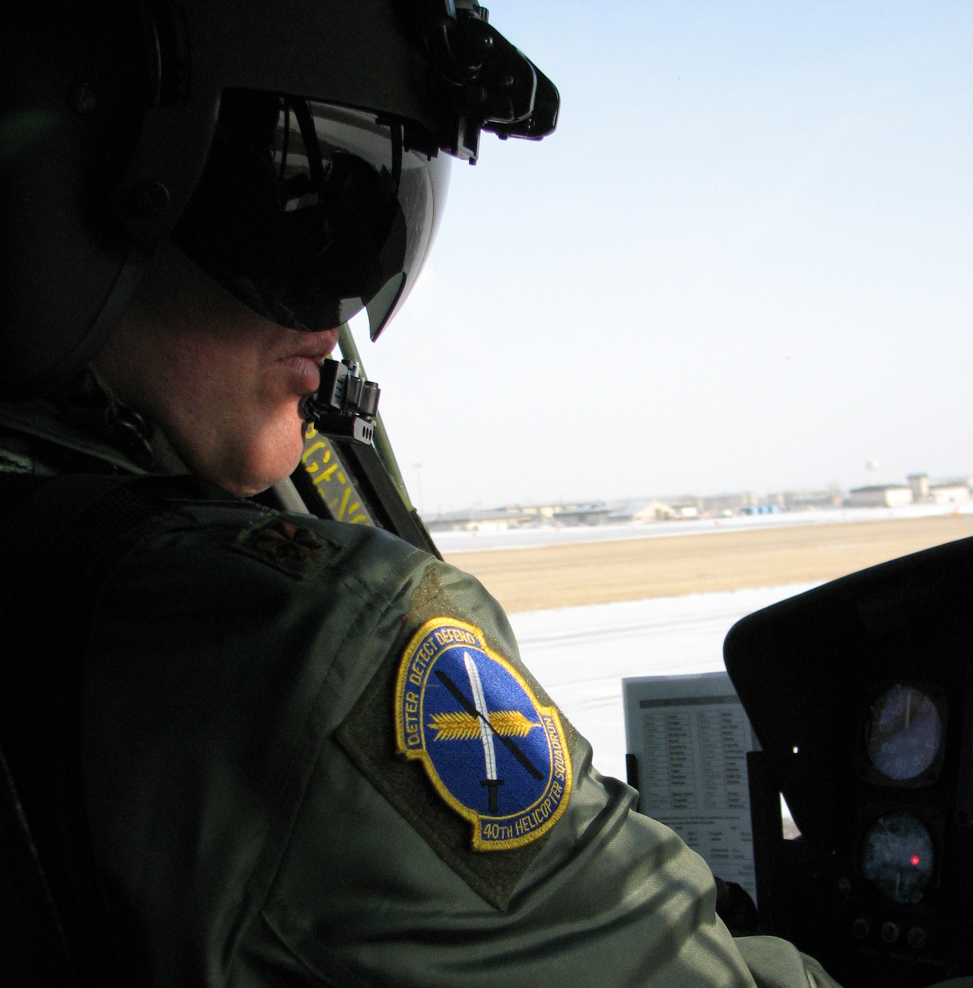 Major Kurt Geisen, 40th Helicopter Squadron pilot, lands a UH-1N Huey helicopter on the flight line Feb. 25, during flight exercises. (U.S. Air Force photo/Senior Airman Dillon White)